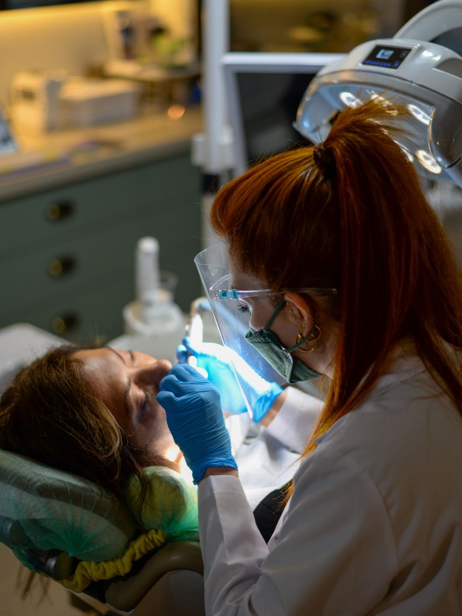A dentist treating a patient in a modern clinic