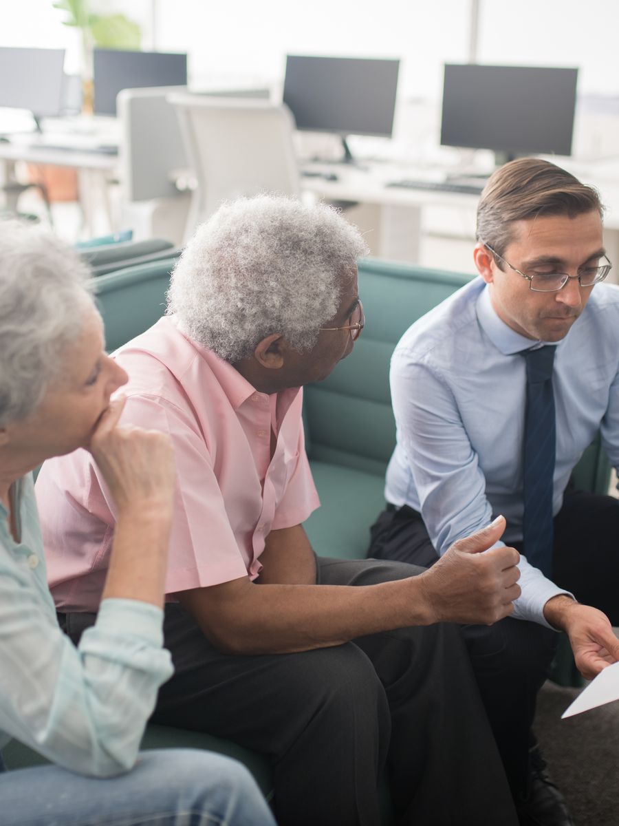 An advisor consulting with clients in an office