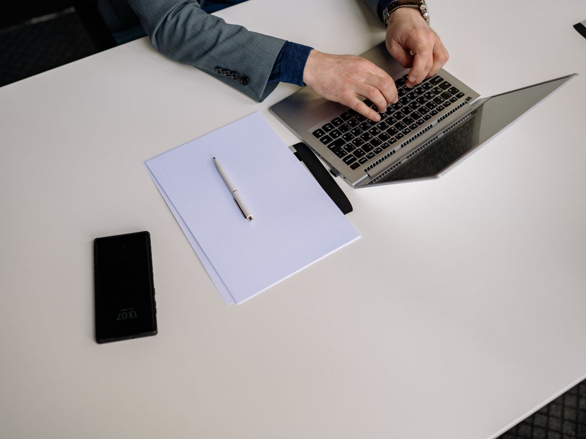 An advisor reviewing results on a laptop