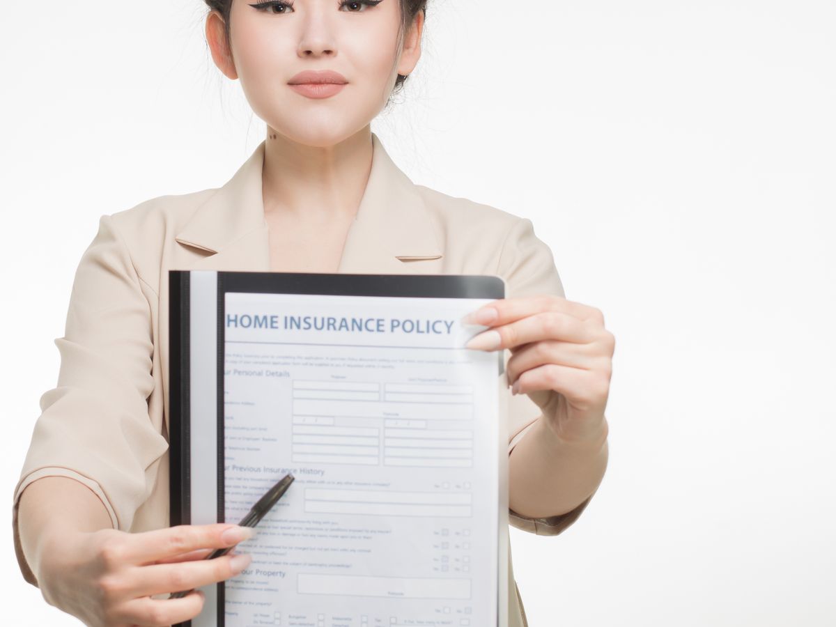 An insurance agent with policy documents