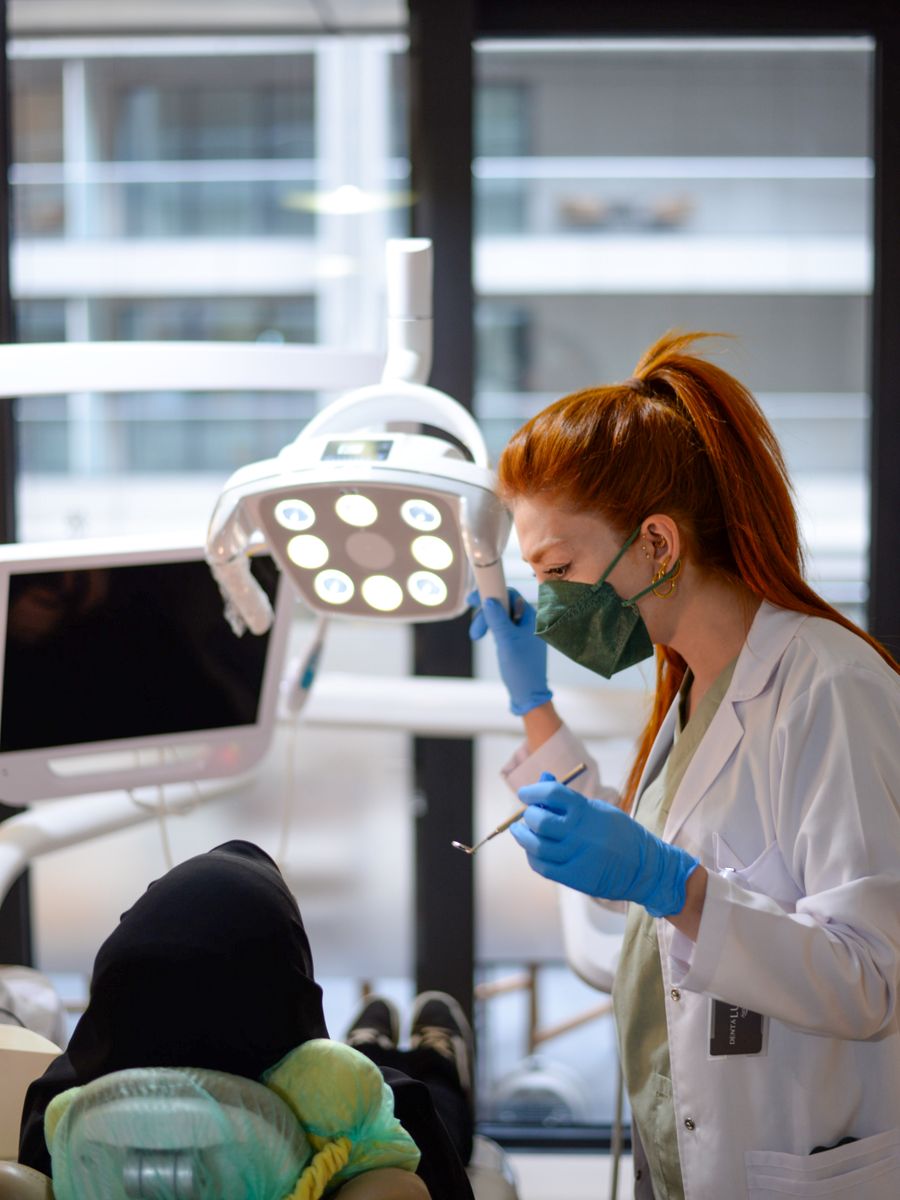 A dentist treating a patient in a modern clinic